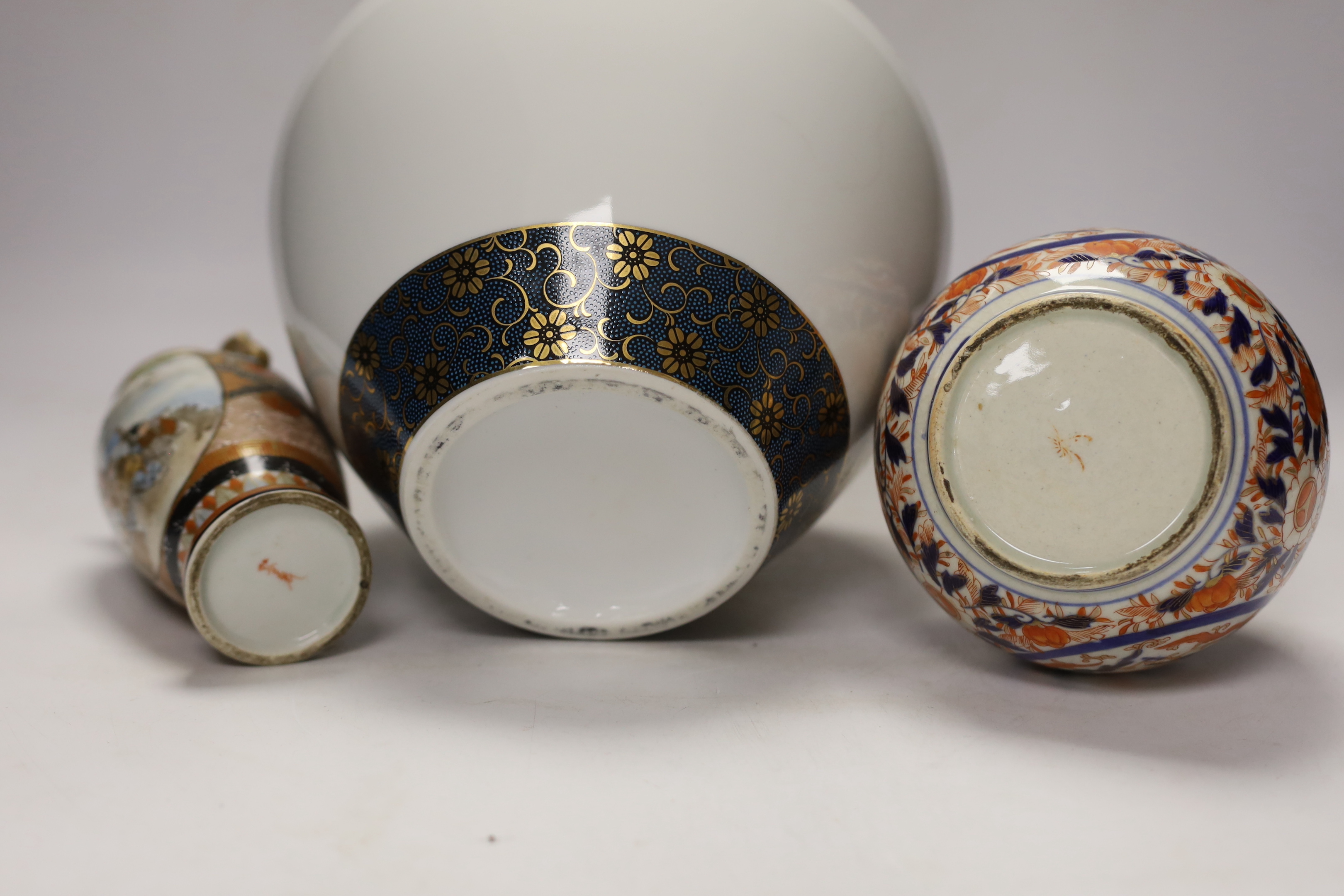 Japanese ceramics including an Imari bottle vase, a Satsuma vase and Kutani eggshell porcelain, tallest 22cm (8)